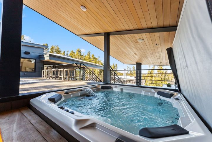 Eight-person hot tub on the covered rooftop spa deck