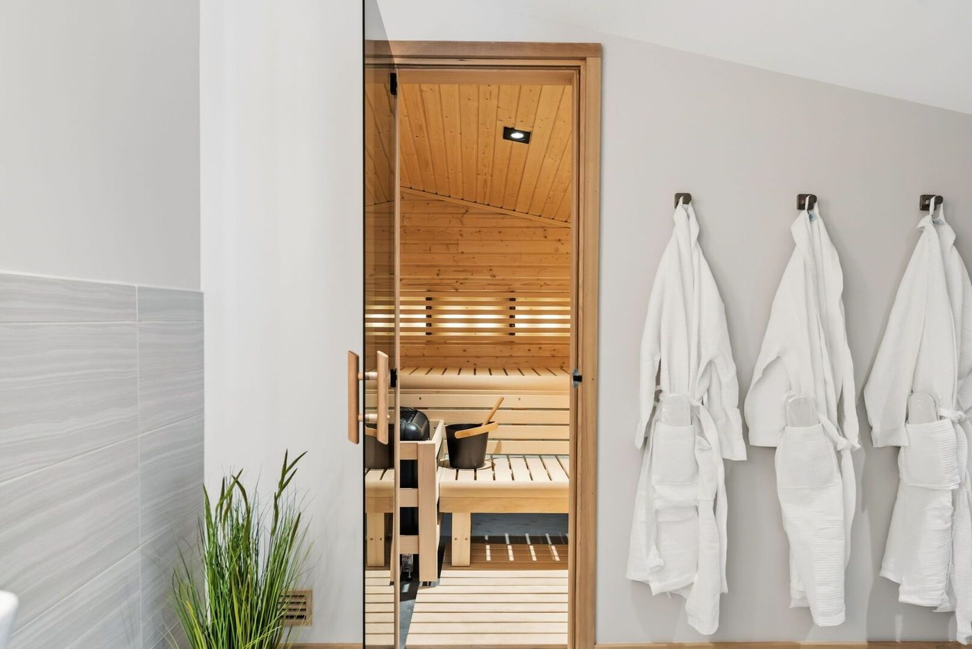 Auria spa vestibule with robes and cedar sauna