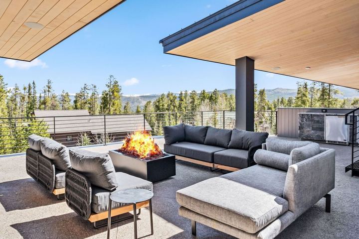 Heated terrace with fire feature and mountain views